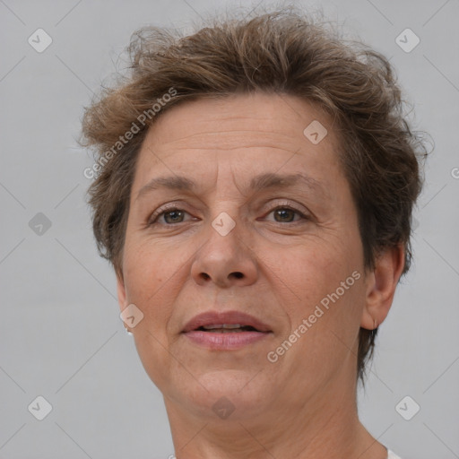 Joyful white middle-aged female with short  brown hair and brown eyes