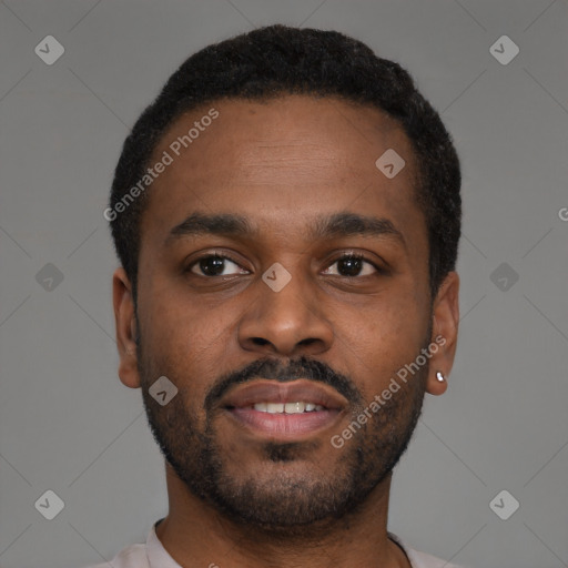 Joyful black young-adult male with short  black hair and brown eyes