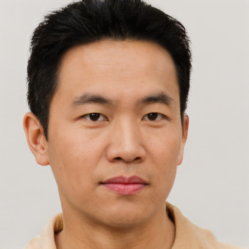 Neutral asian adult male with short  black hair and brown eyes
