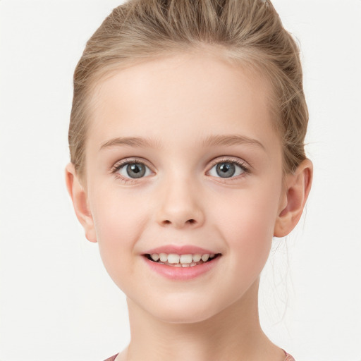 Joyful white child female with short  brown hair and grey eyes