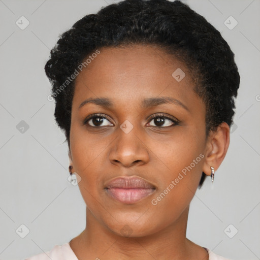 Joyful black young-adult female with short  black hair and brown eyes