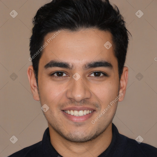 Joyful white young-adult male with short  black hair and brown eyes