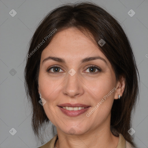 Joyful white adult female with medium  brown hair and brown eyes