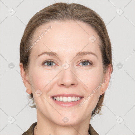 Joyful white young-adult female with medium  brown hair and grey eyes