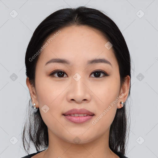 Joyful asian young-adult female with medium  black hair and brown eyes