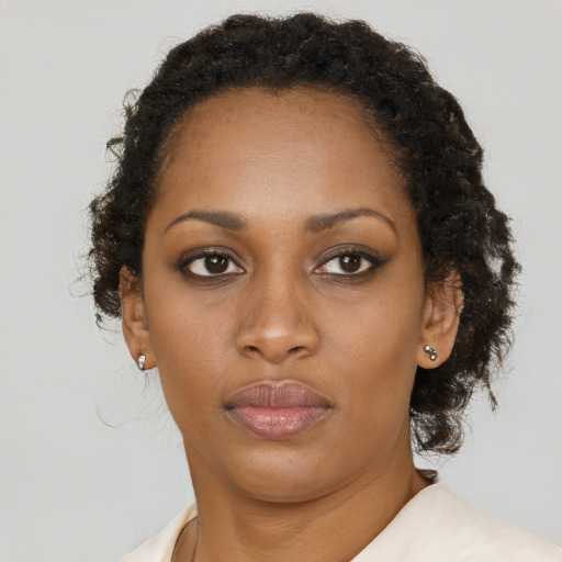 Neutral black young-adult female with short  brown hair and brown eyes