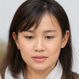 Neutral asian young-adult female with medium  brown hair and brown eyes