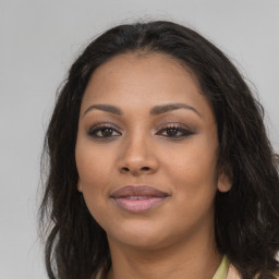 Joyful latino young-adult female with long  brown hair and brown eyes