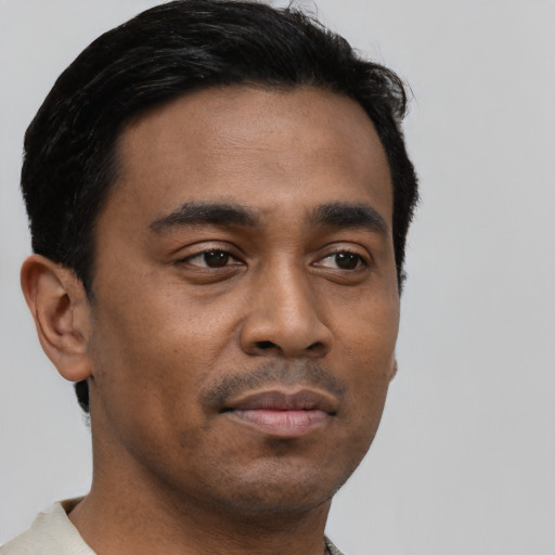 Neutral black young-adult male with short  brown hair and brown eyes