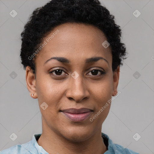 Joyful black young-adult female with short  brown hair and brown eyes