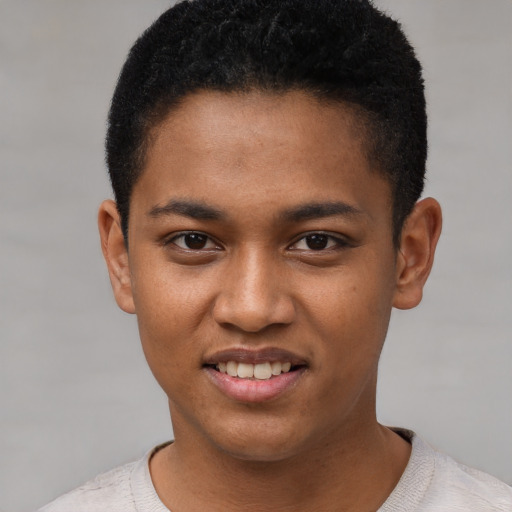 Joyful black young-adult male with short  black hair and brown eyes