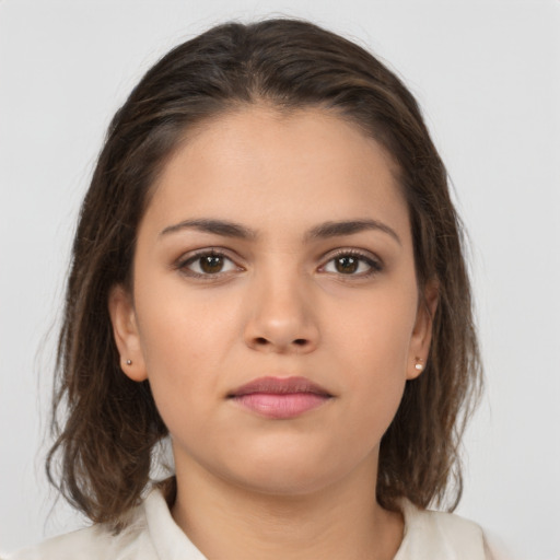 Neutral white young-adult female with medium  brown hair and brown eyes