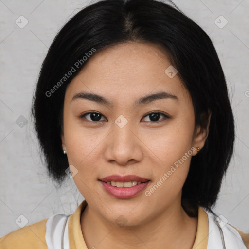 Joyful asian young-adult female with medium  black hair and brown eyes