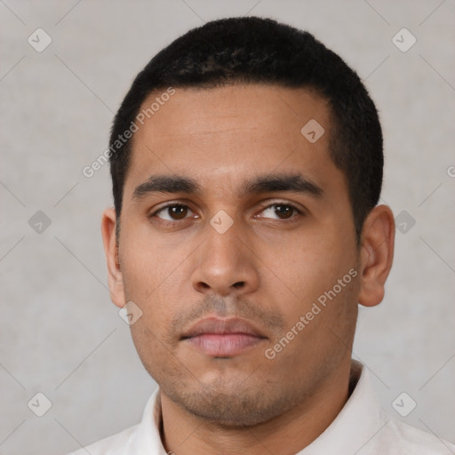 Neutral latino young-adult male with short  black hair and brown eyes