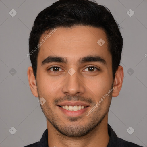 Joyful white young-adult male with short  black hair and brown eyes