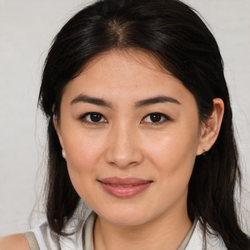 Joyful white young-adult female with medium  brown hair and brown eyes
