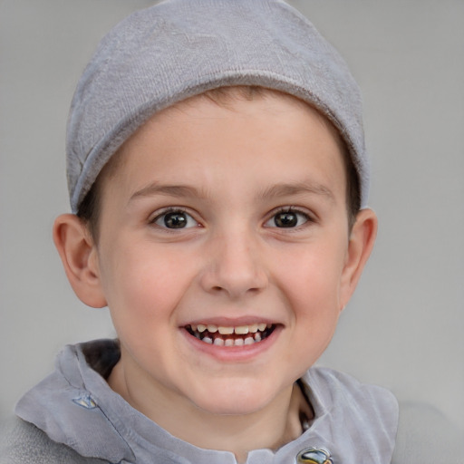 Joyful white child female with short  brown hair and blue eyes