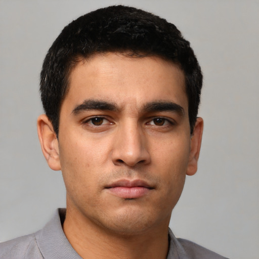 Neutral latino young-adult male with short  brown hair and brown eyes