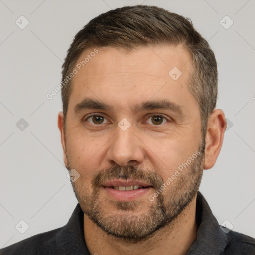 Joyful white adult male with short  brown hair and brown eyes