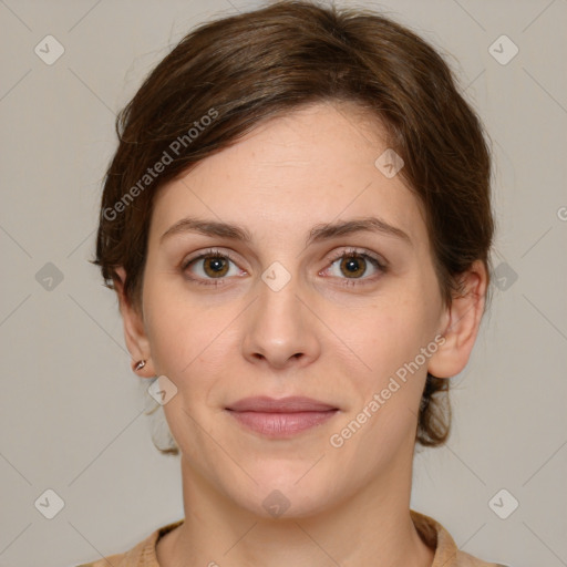 Joyful white young-adult female with medium  brown hair and green eyes