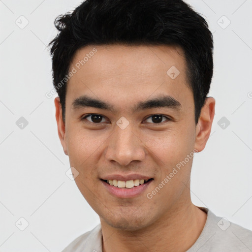 Joyful latino young-adult male with short  black hair and brown eyes