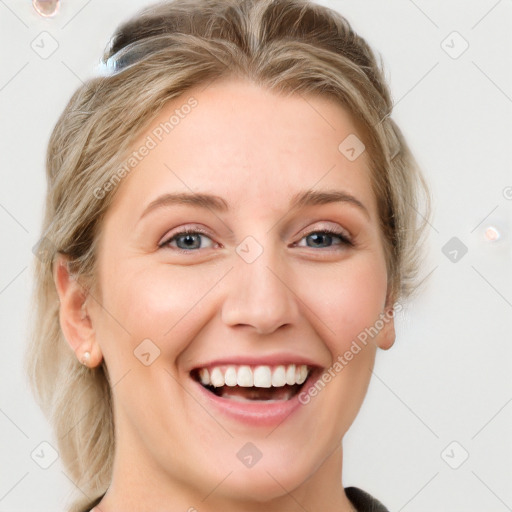 Joyful white young-adult female with medium  brown hair and blue eyes