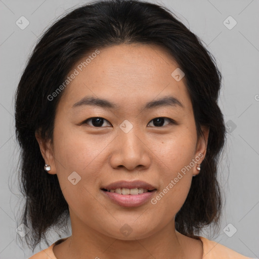 Joyful asian young-adult female with medium  brown hair and brown eyes