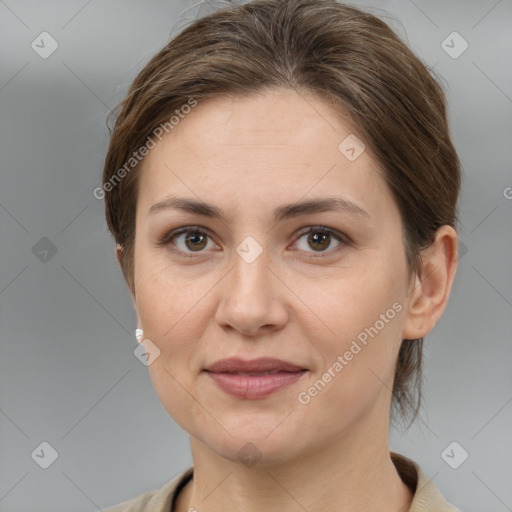 Joyful white adult female with medium  brown hair and grey eyes