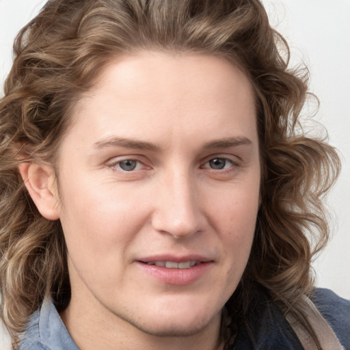 Joyful white young-adult female with medium  brown hair and blue eyes