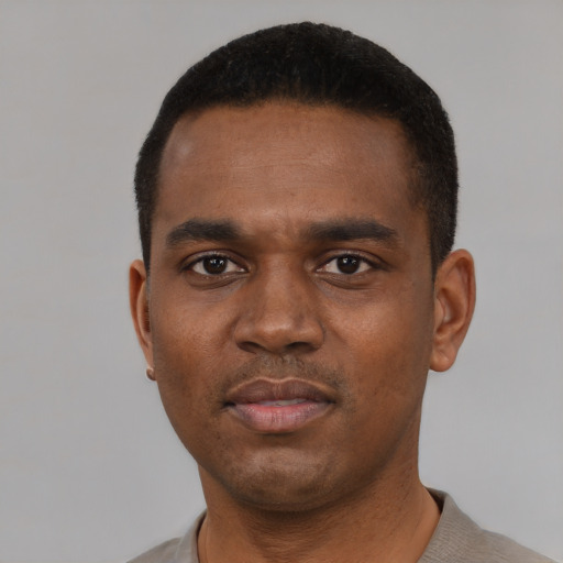 Neutral black young-adult male with short  black hair and brown eyes