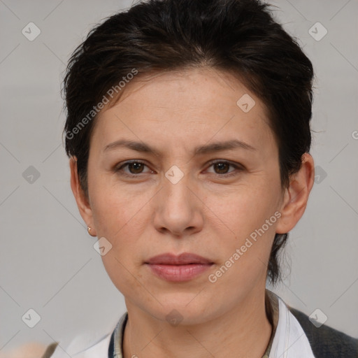 Joyful white adult female with short  brown hair and brown eyes