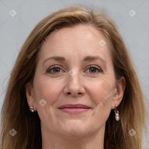 Joyful white adult female with long  brown hair and grey eyes