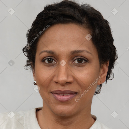 Joyful latino adult female with short  brown hair and brown eyes