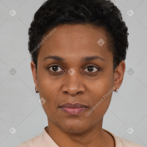 Joyful black young-adult female with short  black hair and brown eyes