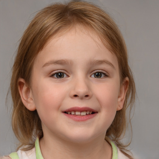 Joyful white child female with medium  brown hair and blue eyes