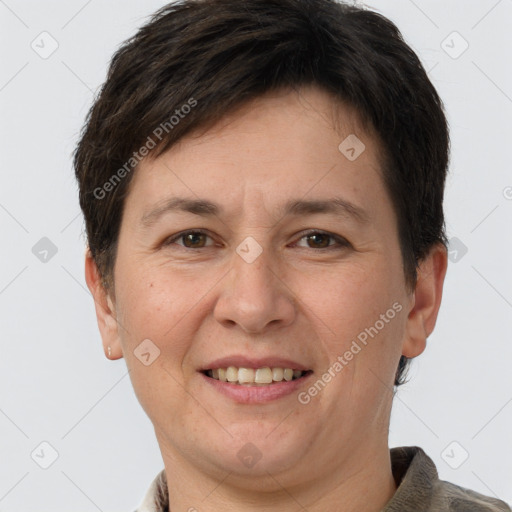 Joyful white adult female with short  brown hair and brown eyes