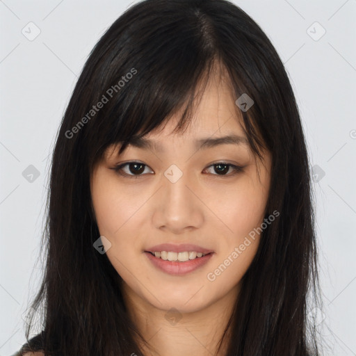 Joyful asian young-adult female with long  brown hair and brown eyes