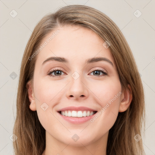 Joyful white young-adult female with long  brown hair and grey eyes