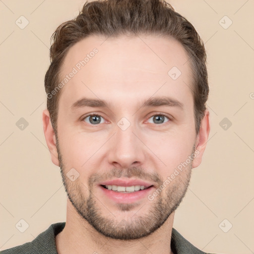 Joyful white young-adult male with short  brown hair and grey eyes