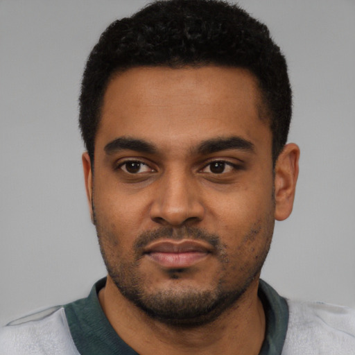 Neutral black young-adult male with short  black hair and brown eyes