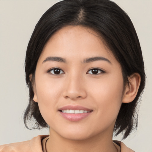 Joyful white young-adult female with medium  brown hair and brown eyes