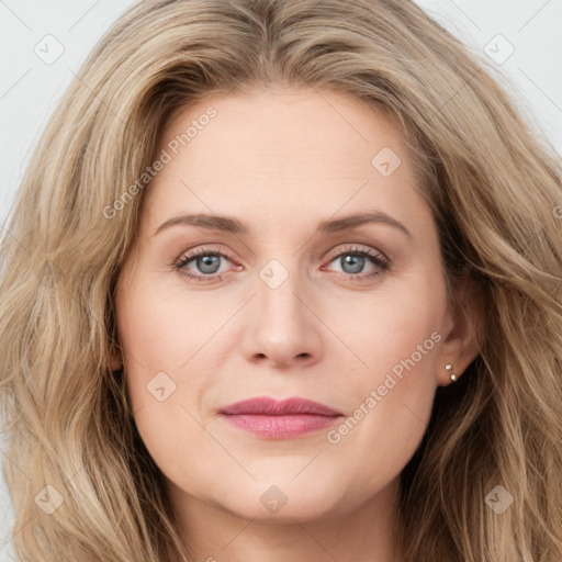 Joyful white young-adult female with long  brown hair and green eyes