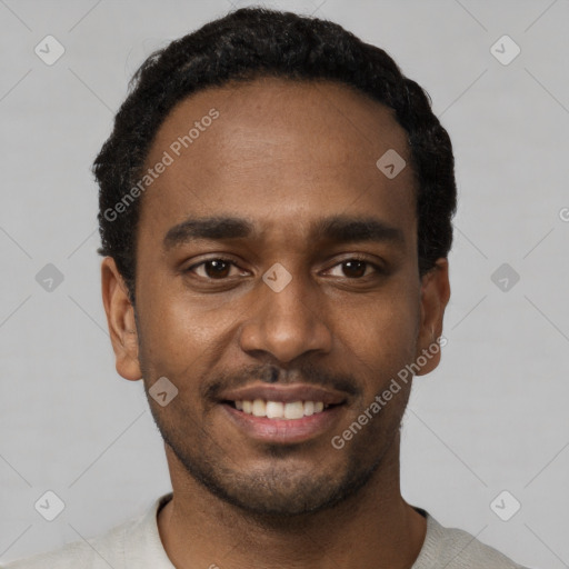 Joyful black young-adult male with short  black hair and brown eyes