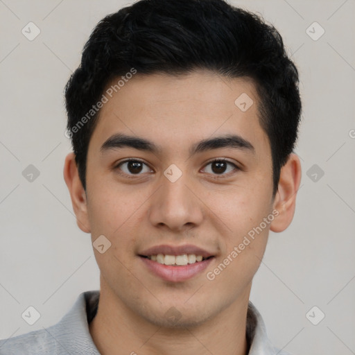 Joyful latino young-adult male with short  brown hair and brown eyes