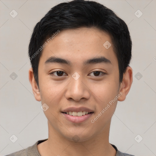 Joyful asian young-adult male with short  black hair and brown eyes