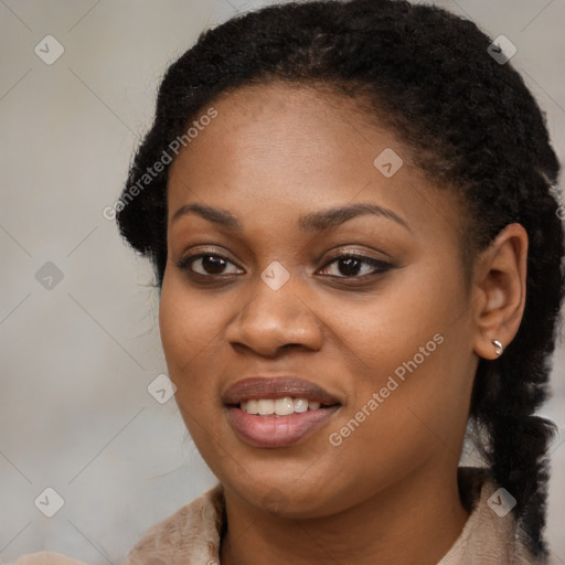 Joyful black young-adult female with long  brown hair and brown eyes