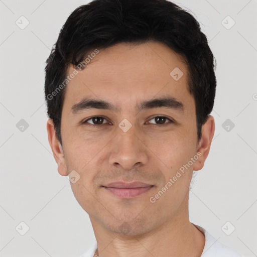 Joyful asian young-adult male with short  black hair and brown eyes