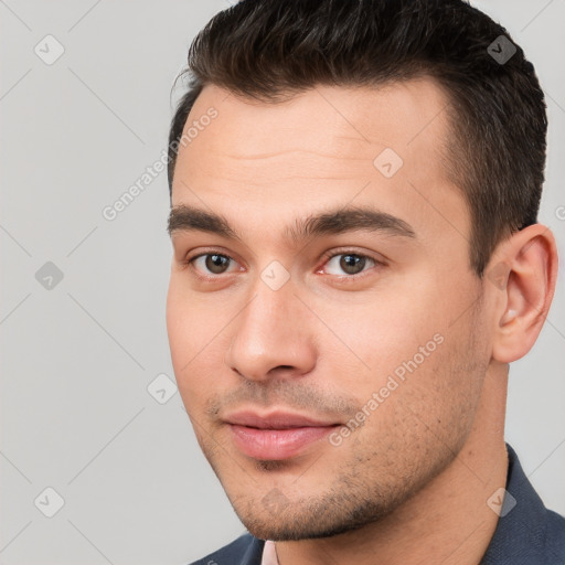 Joyful white young-adult male with short  brown hair and brown eyes