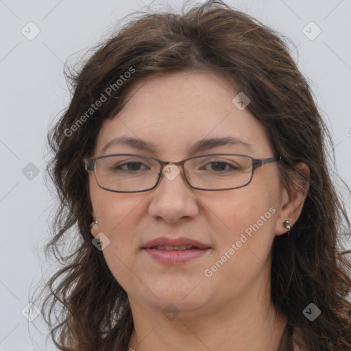 Joyful white adult female with long  brown hair and brown eyes