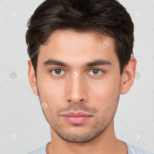 Neutral white young-adult male with short  brown hair and brown eyes